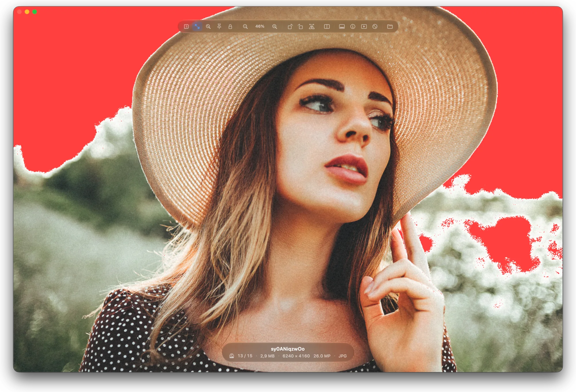 Clipping warnings on: the blown sky behind a portrait is marked in red.